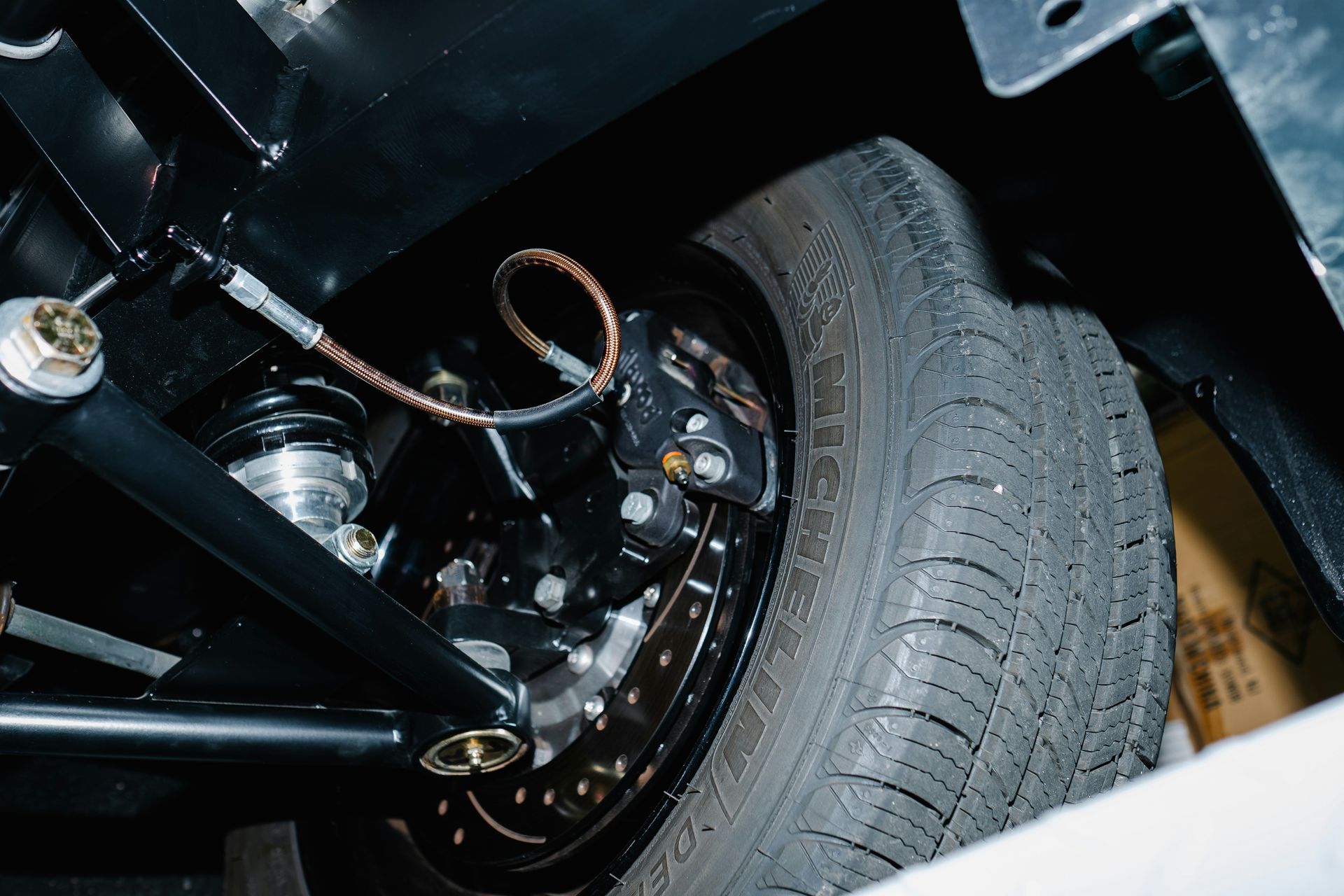 Close-up of a car's tire and brake system